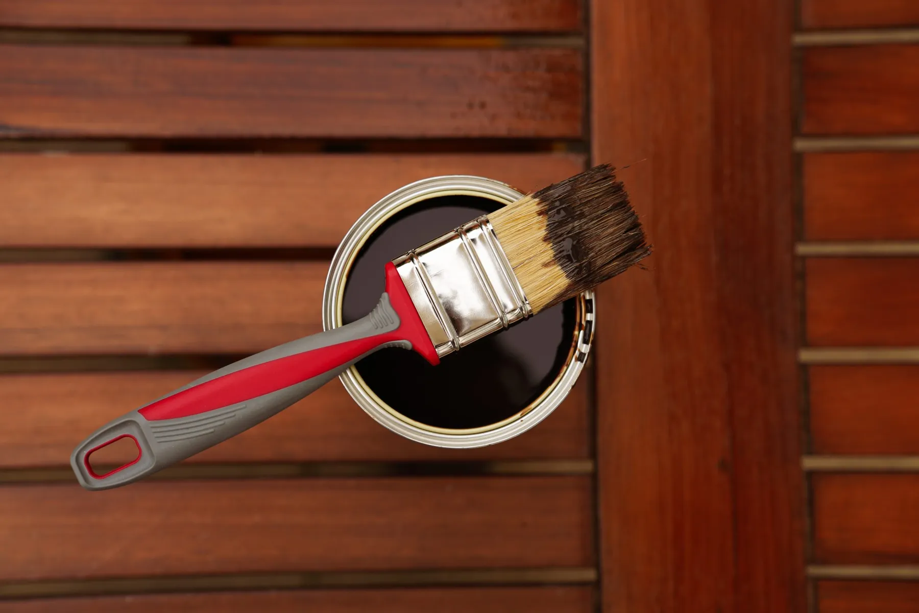 Door wrapped in wood-effect architectural film