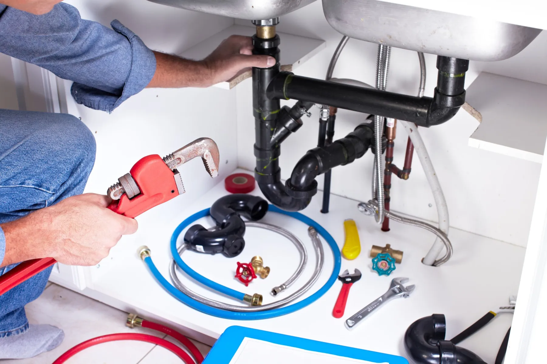 Sink plumbing concealed inside a cabinet