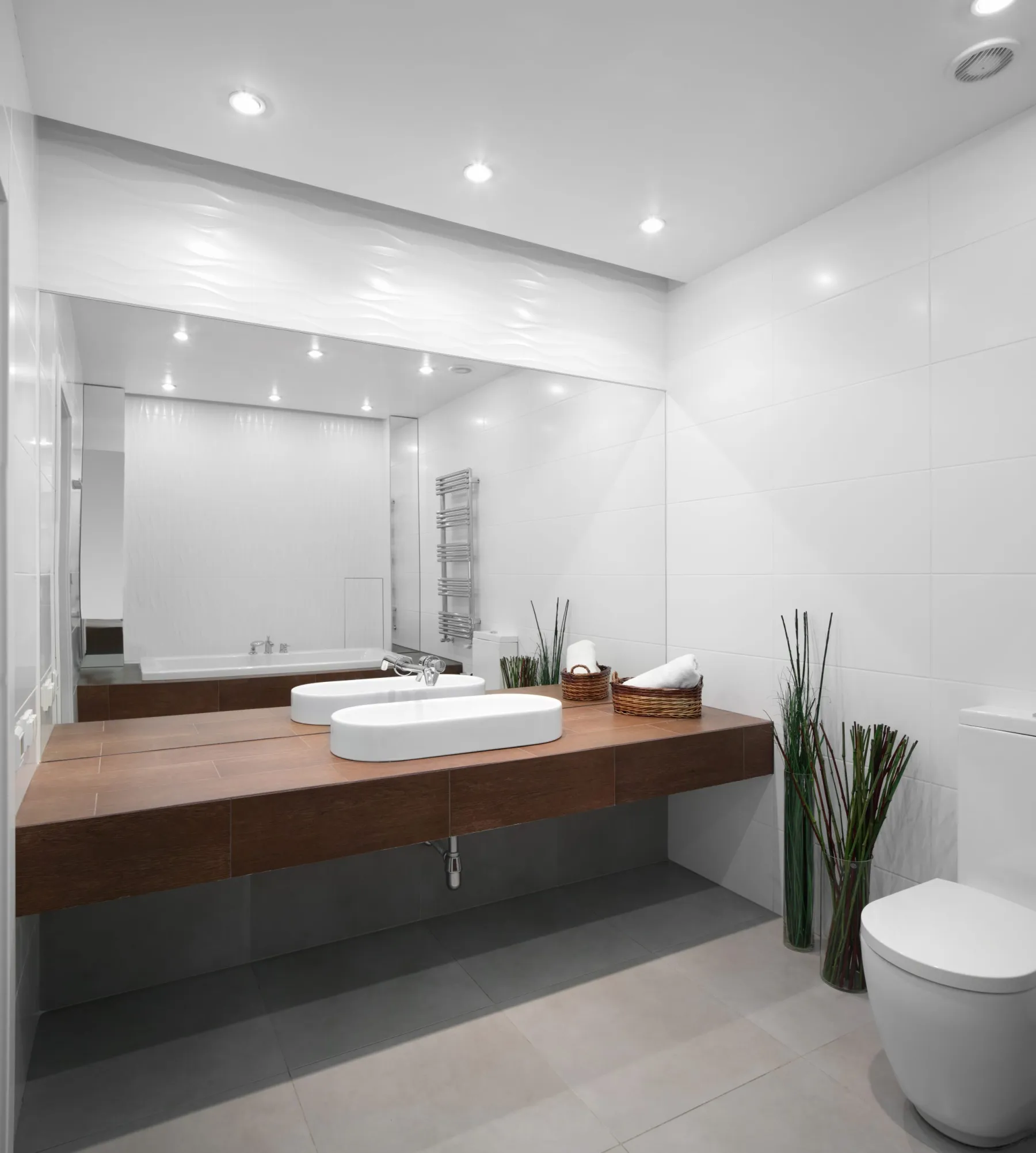Backlit mirror installation in a Dubai bathroom
