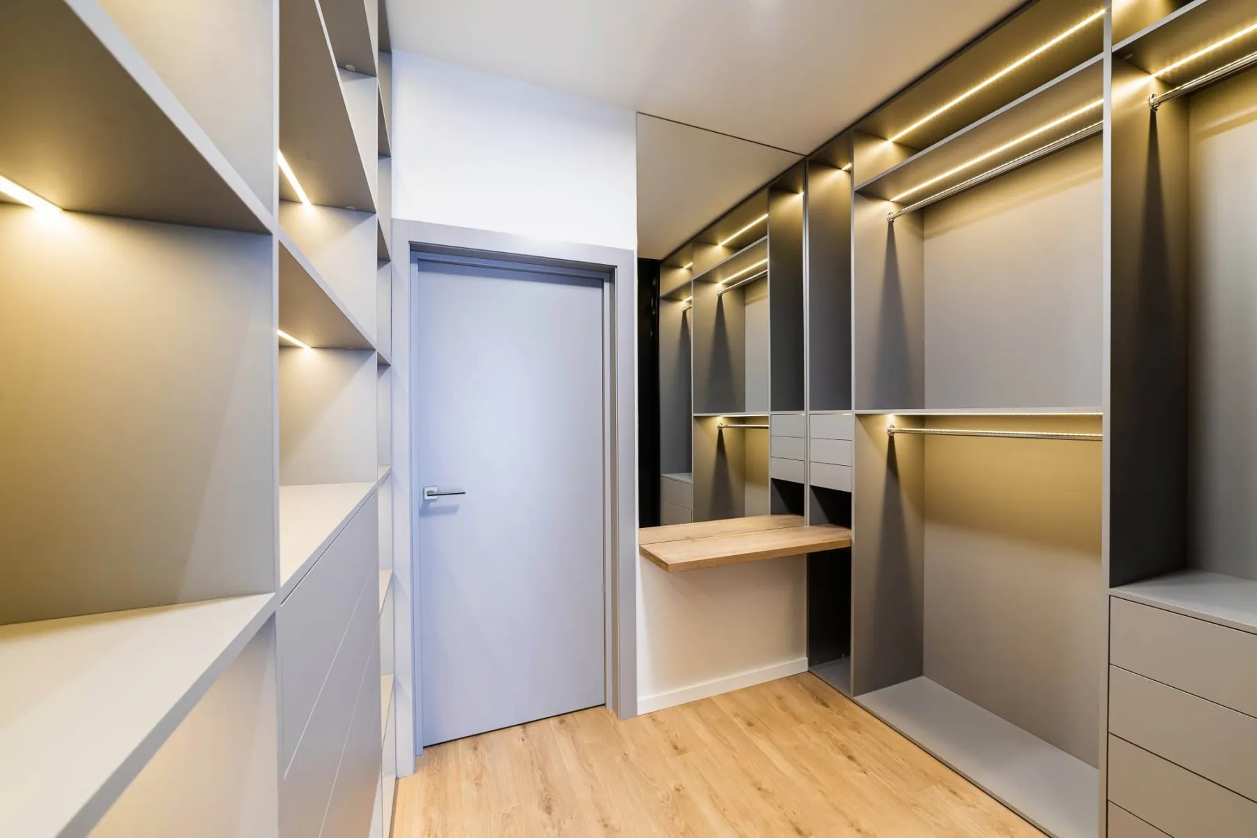 Dressing room with glass fronted units in Dubai