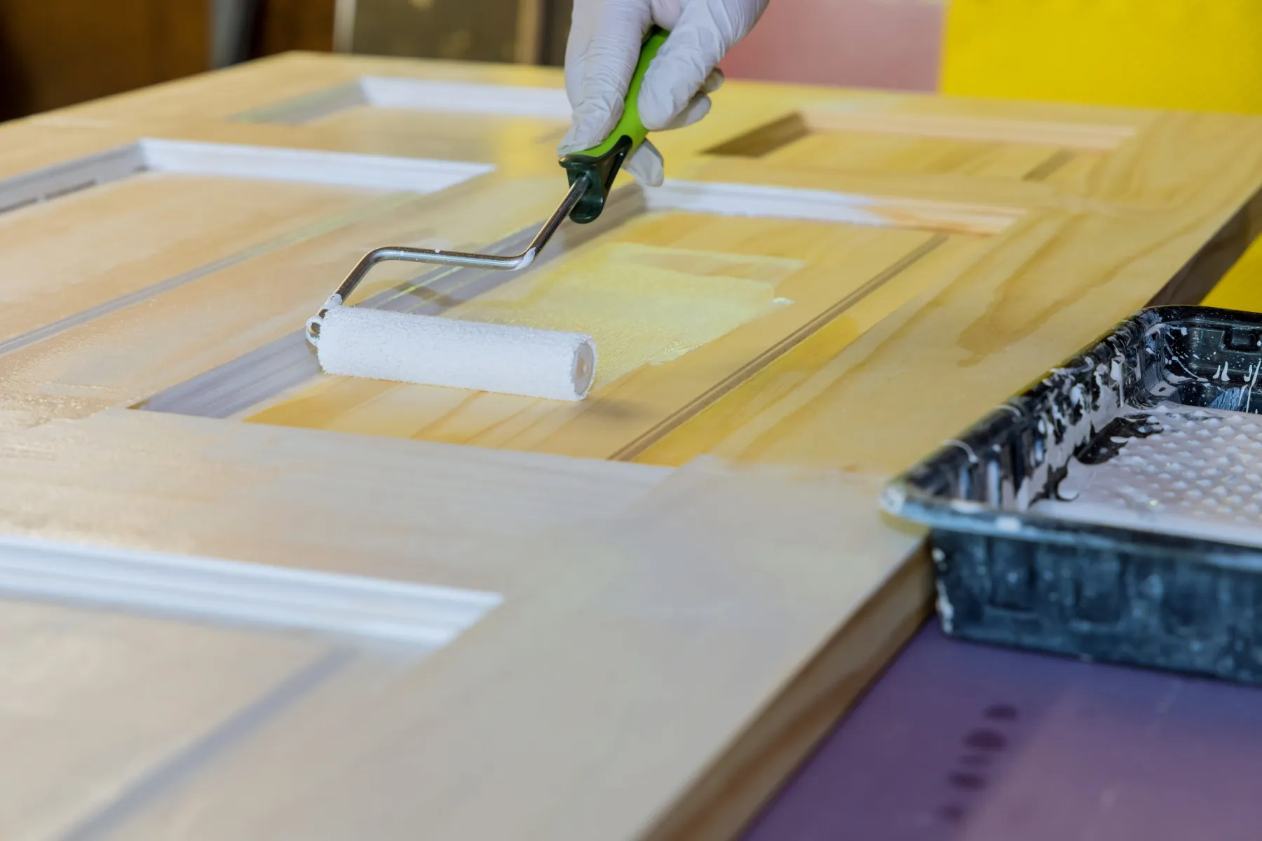 Applying finish coats in the spray booth